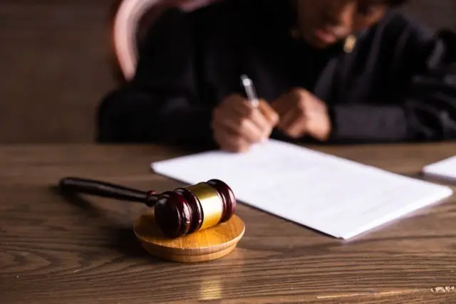 A judge doing paperwork