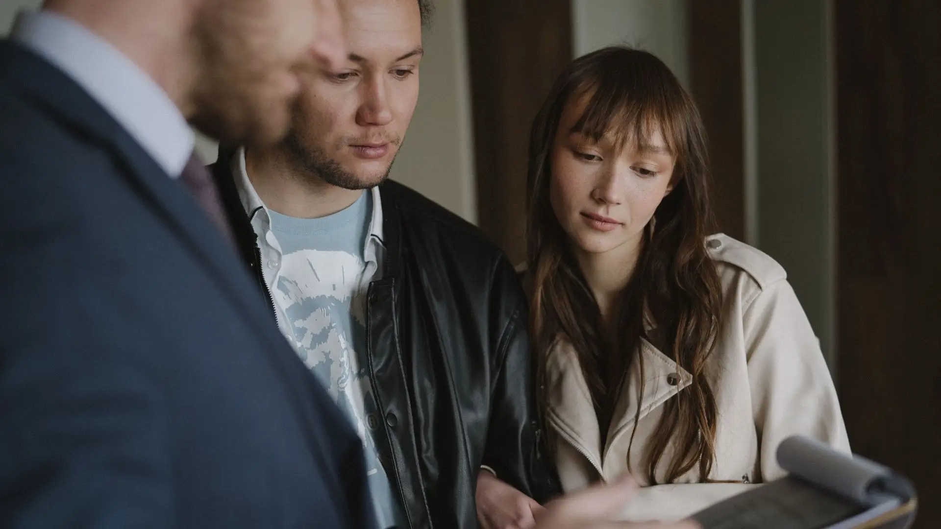 A couple speaking with a realtor